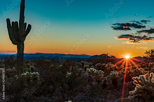 Sunset creates a starburst in the Arizona desert photo