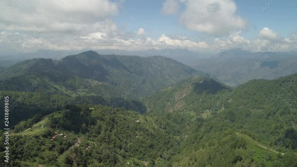 Aerial view mountains covered forest, trees. Cordillera region. Luzon, Philippines. Slopes of mountains with evergreen vegetation. Mountainous tropical landscape. Aerial view mountains covered forest, trees. Cordillera region. Luzon, Philippines. Slopes of mountains with evergreen vegetation. Mountainous tropical landscape.