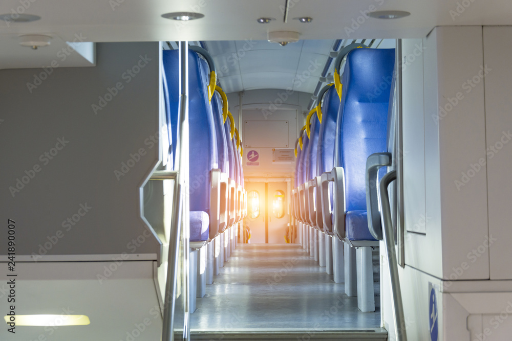 Obraz premium Salon inside of the speed commuter train with empty seats.