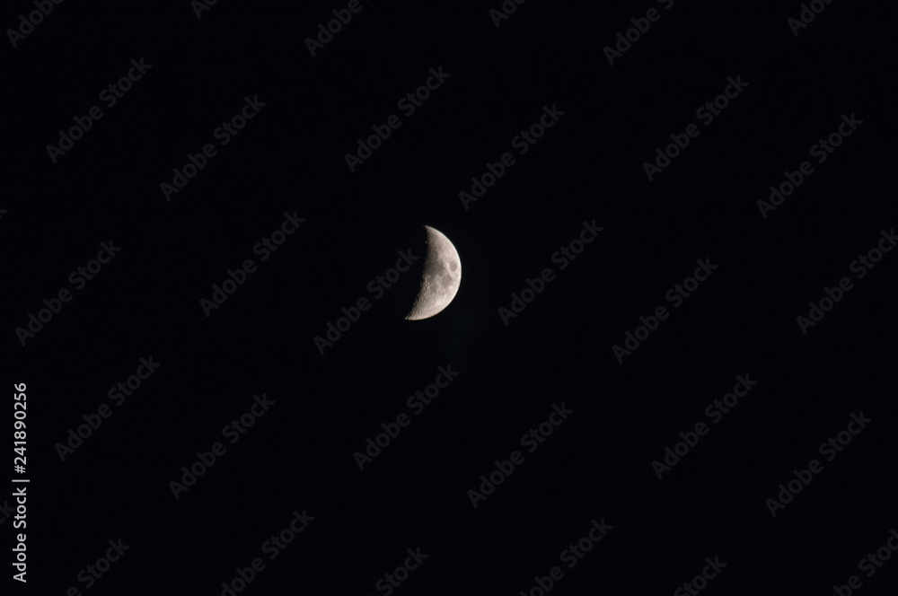Moon in the night sky. Night sky with a month Moon in the night sky. Night sky with a month
