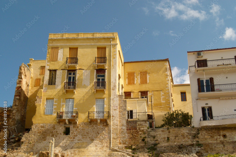 New buildings in Chania are built on the foundations of old yellow brick buildings