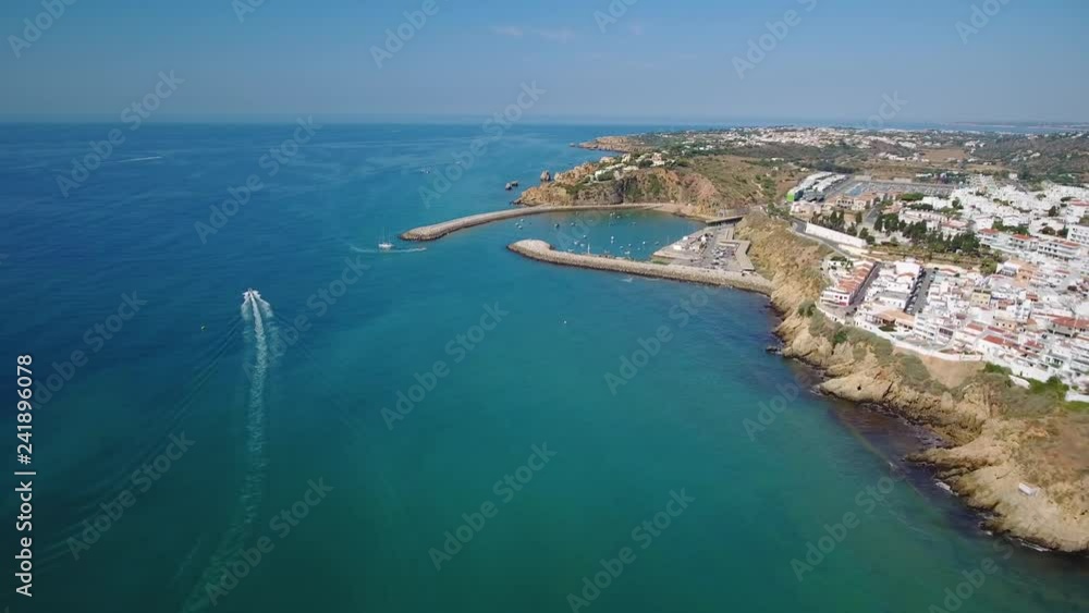 Aerial. Shooting from sky of Portuguese tourist city of Lagos, overlooking dock and the beaches. Aerial. Shooting from sky of Portuguese tourist city of Lagos, overlooking dock and the beaches.