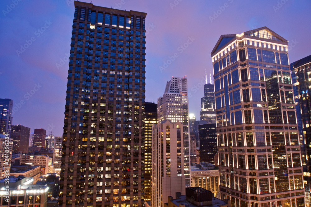View of skyscrapers and buildings in downtown Chicago after sunset with amazing blue and pink sky View of skyscrapers and buildings in downtown Chicago after sunset with amazing blue and pink sky