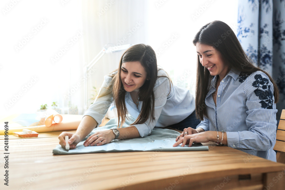 two women friends communicate and do needlework two women friends communicate and do needlework