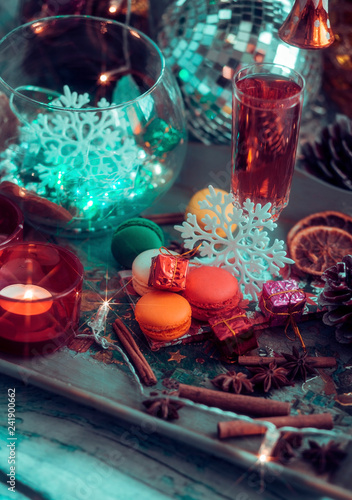 Christmas still life with glass of wine and macaroons