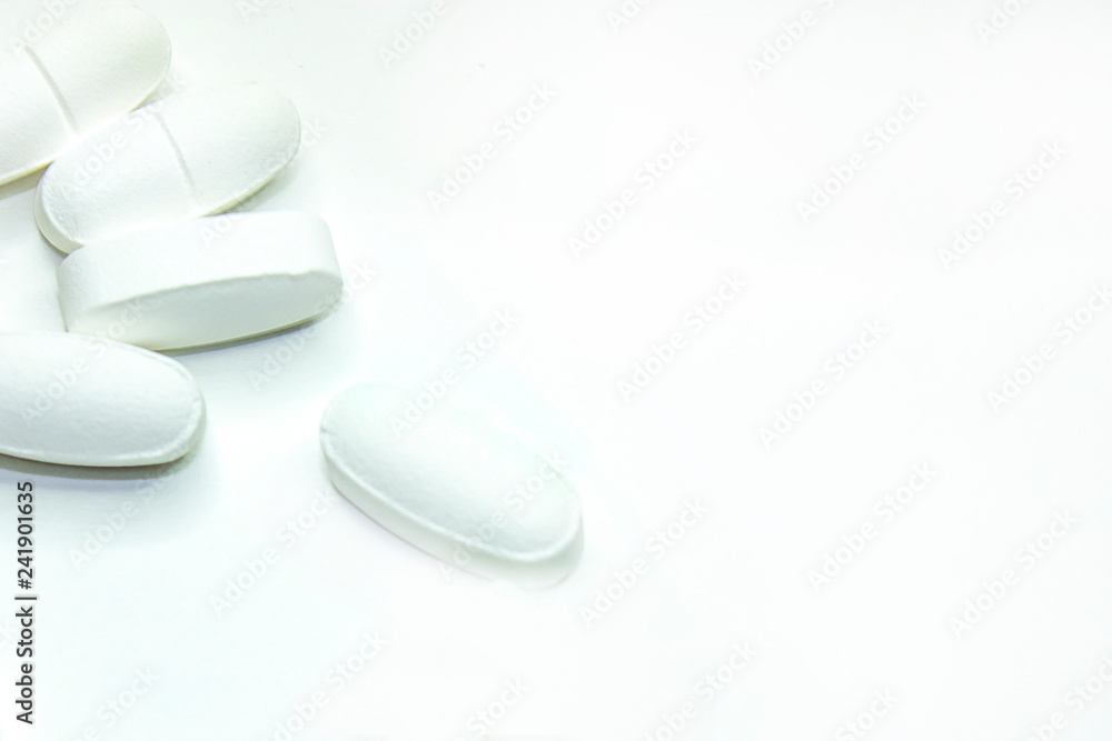 white medical pills, on white background, close-up white medical pills, on white background, close-up