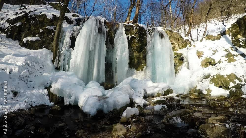 Waterfall in the National Park Slovak Karst, in the village named Haj in winter
