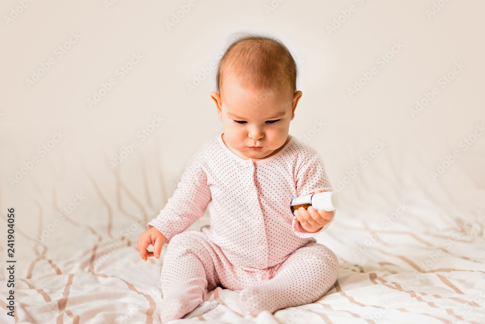 Baby toddler boy girl reaching playing pills medicine hazard danger poison Baby toddler boy girl reaching playing pills medicine hazard danger poison
