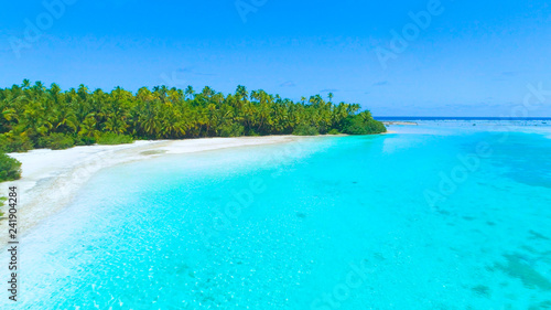 DRONE: Cool flying view of the unspoiled tropical sandy beaches in Cook Islands. © helivideo