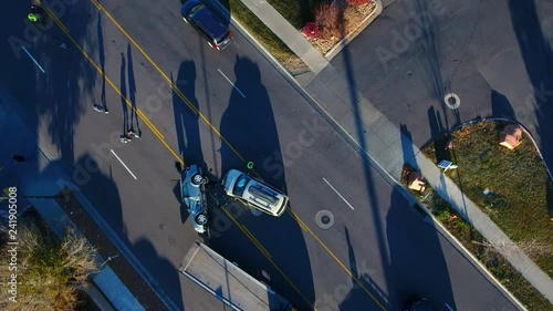 People at an car accident from above.