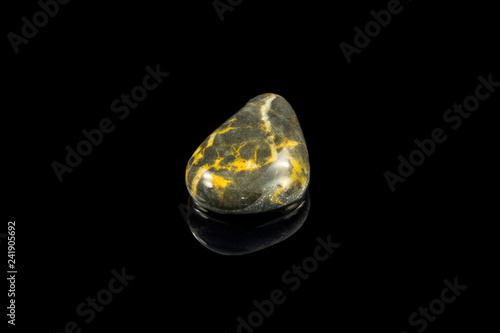 Colorful stone with different designs and colors and black background