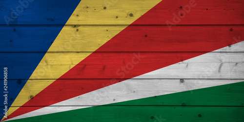 Flag of Seychelles on wooden background, surface. Wooden wall, planks. National flag
