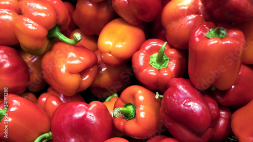 Red fresh bell pepper or capsicum in the market used for your pattern or your background design. Food and healthy care concept