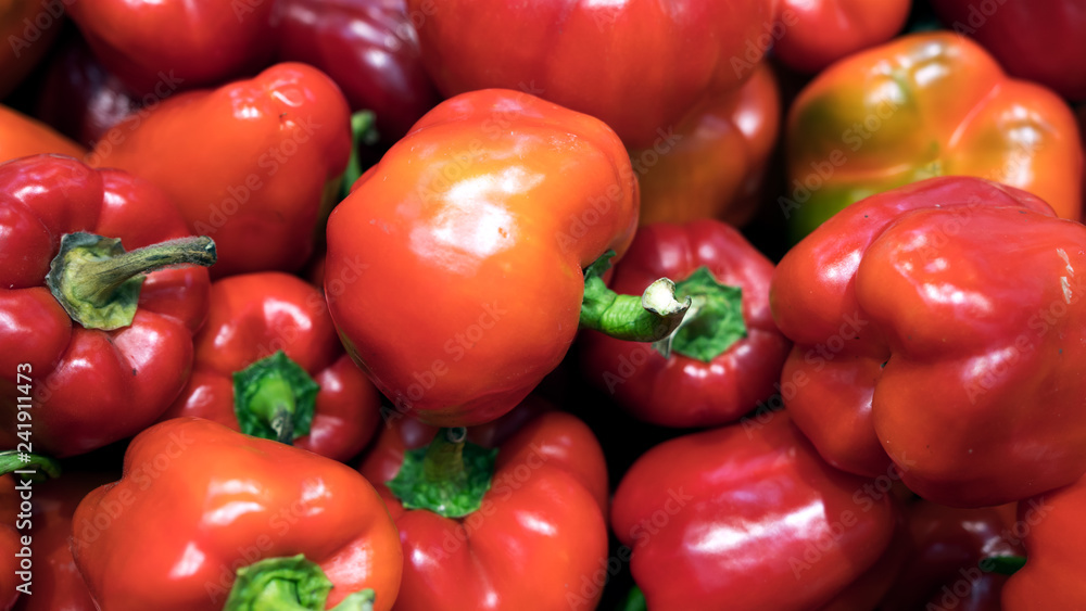 Red fresh bell pepper or capsicum in the market used for your pattern or your background design. Food and healthy care concept Red fresh bell pepper or capsicum in the market used for your pattern or your background design. Food and healthy care concept