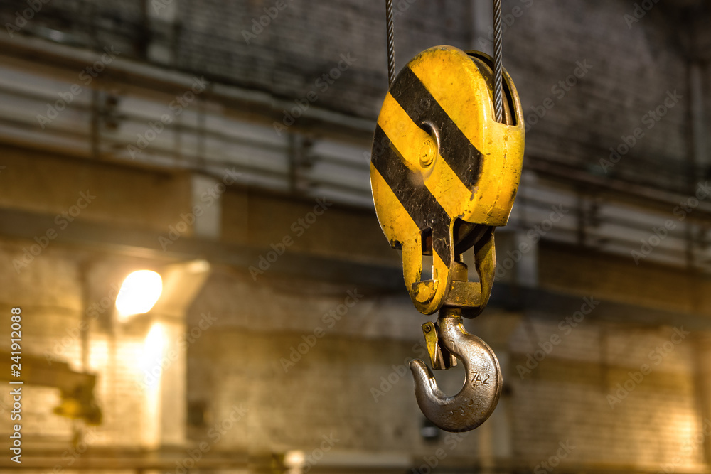 Close up hook crane of overhead crane in factory, machine part concept Close up hook crane of overhead crane in factory, machine part concept