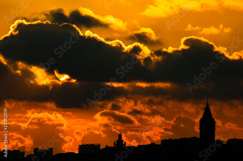 Sun and clouds with Silhouette of Galata Tower  © senerdagasan