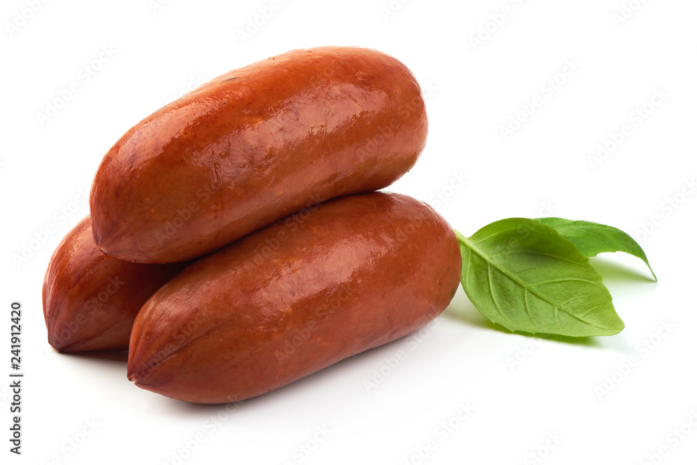 Delicious Smoked Sausages with basil leaves, close-up, isolated on a white background Delicious Smoked Sausages with basil leaves, close-up, isolated on a white background