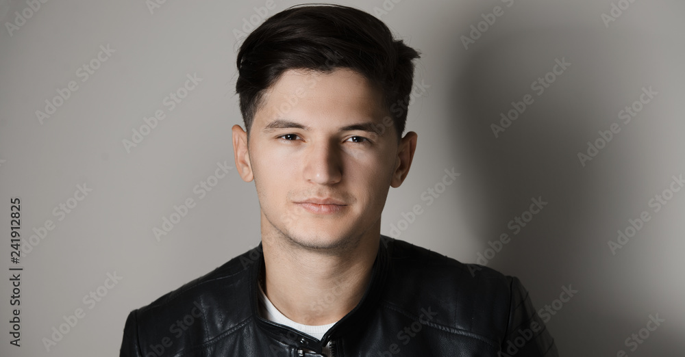 Studio portrait of thoughtful young modern guy. Studio portrait of thoughtful young modern guy.