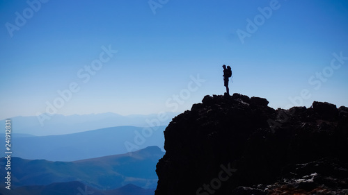 Hiking man on cliff