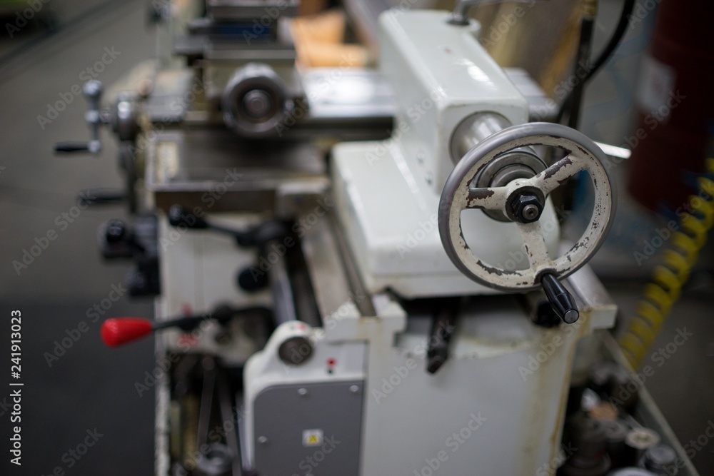Lathe machine for metal cutting, machinery center background. Lathe machine for metal cutting, machinery center background.