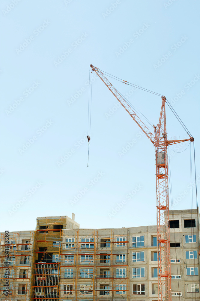 Constructions cranes near building. Construction site with crane and building.