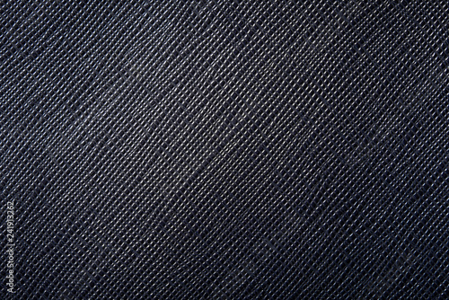 background or texture of dark blue natural leather closeup