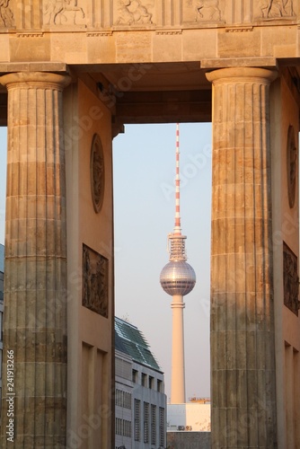 View to the Berlin TV Tower through the Brandenburg Gate in Berlin, Germany photo