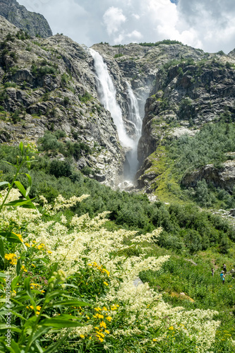 Waterfall in nature. Georgia/ Mestia. Travel concept photo.