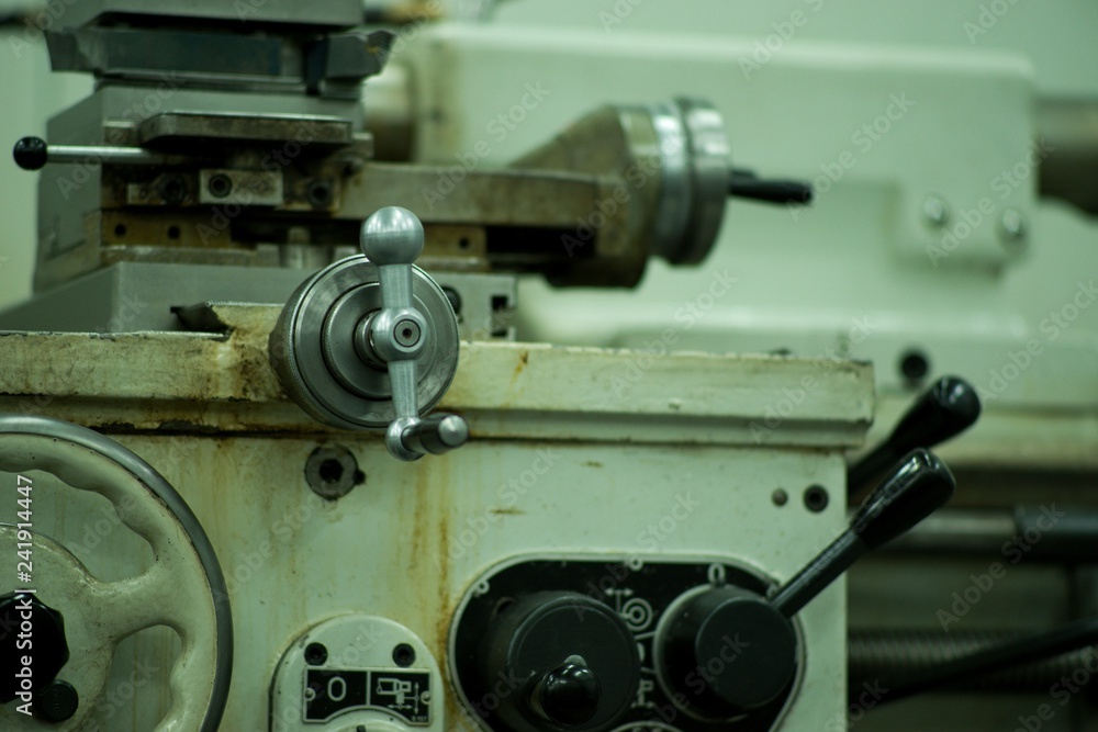 Lathe machine for metal cutting, machinery center background. Lathe machine for metal cutting, machinery center background.