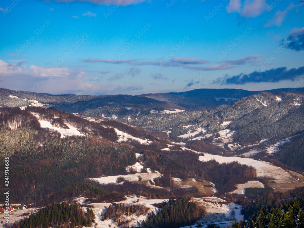 Valley of Piwniczna-Zdroj in winter. View from Piwowarowka. Beskids Mountains, Poland.