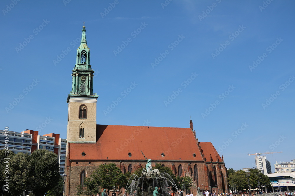 St. Mary's Church and Neptune's Fountain at Alexanderplatz in Berlin, Germany