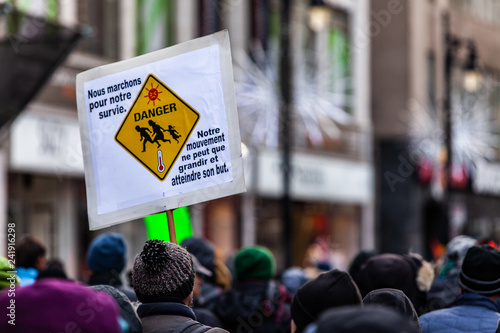 Activists marching for the environment. French sign seen in an ecological protest saying we walk for our survival. Our movement can only grow and reach his goal © Valmedia