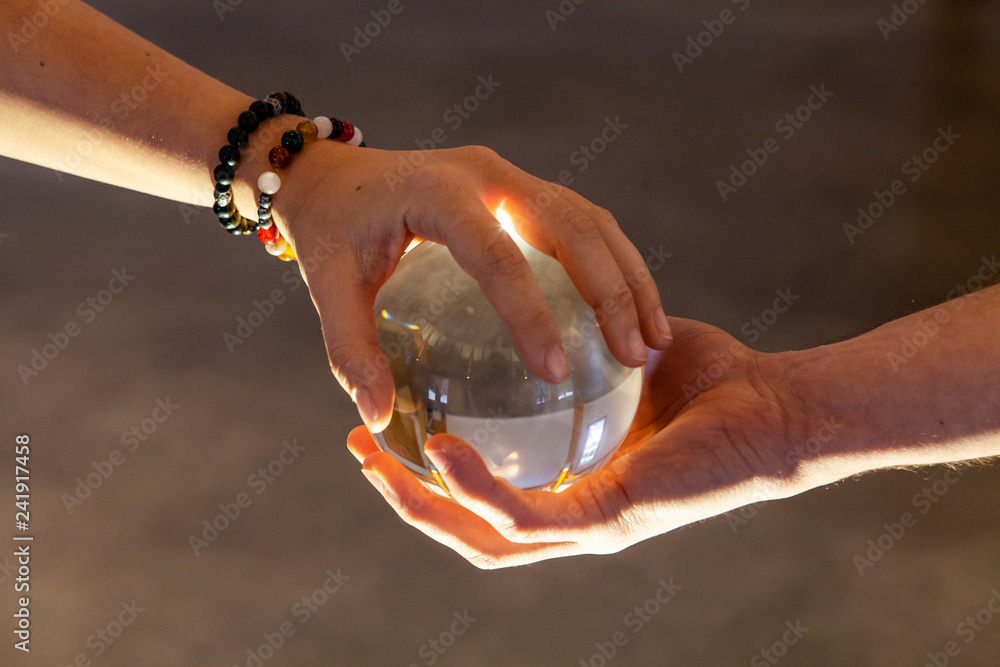 hand holding crystal ball