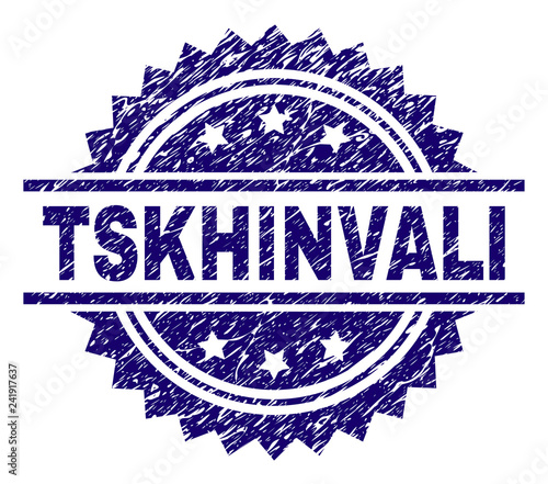 TSKHINVALI stamp seal watermark with distress style. Blue vector rubber print of TSKHINVALI title with unclean texture. photo