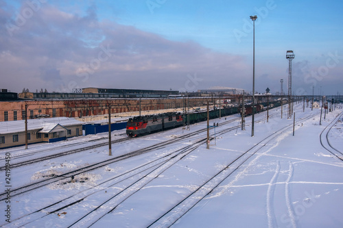 Railway station and trains in winter city, aerial view © Mulderphoto