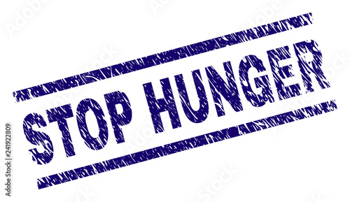 STOP HUNGER seal watermark with scratced style. Blue vector rubber print of STOP HUNGER text with scratched texture. Text title is placed between parallel lines.