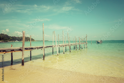 Wooden platform entering the turquoise sea on Koh Sameth island in Thailand.