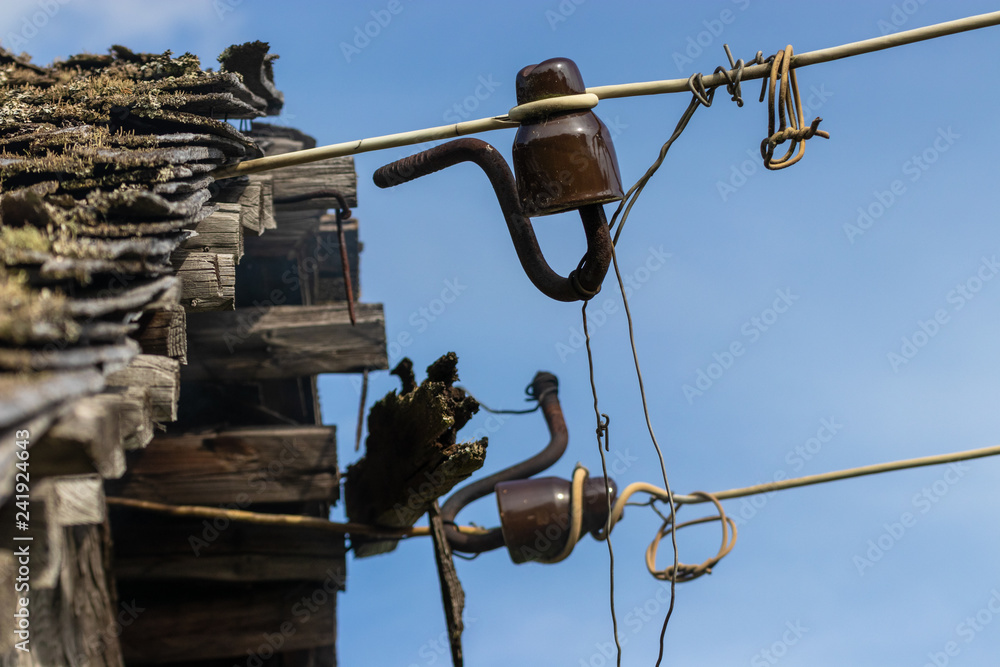 Insulators are hanging on the wires. Emergency condition of wiring Insulators are hanging on the wires. Emergency condition of wiring
