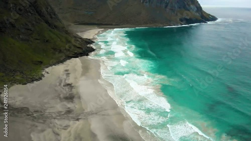 Norwegian beach aerial footage Lofoten islands. Kvalvika beach. Norwegian nature. Remote beach hidden in the mountains