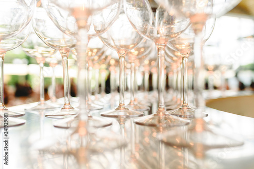 Group of empty transparent glasses ready for a party in a bar. © Joaquin Corbalan