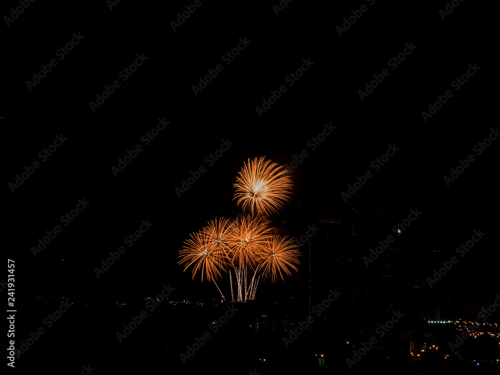 Colorful fireworks display over city . Firework celebration sparkling in midnight sky, countdown , khonkaen, Thailand