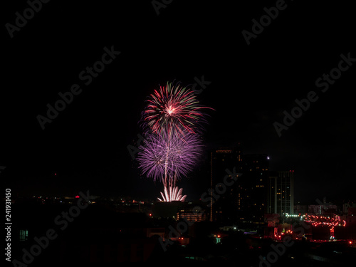 Colorful fireworks display over city . Firework celebration sparkling in midnight sky, countdown , khonkaen, Thailand © manoch
