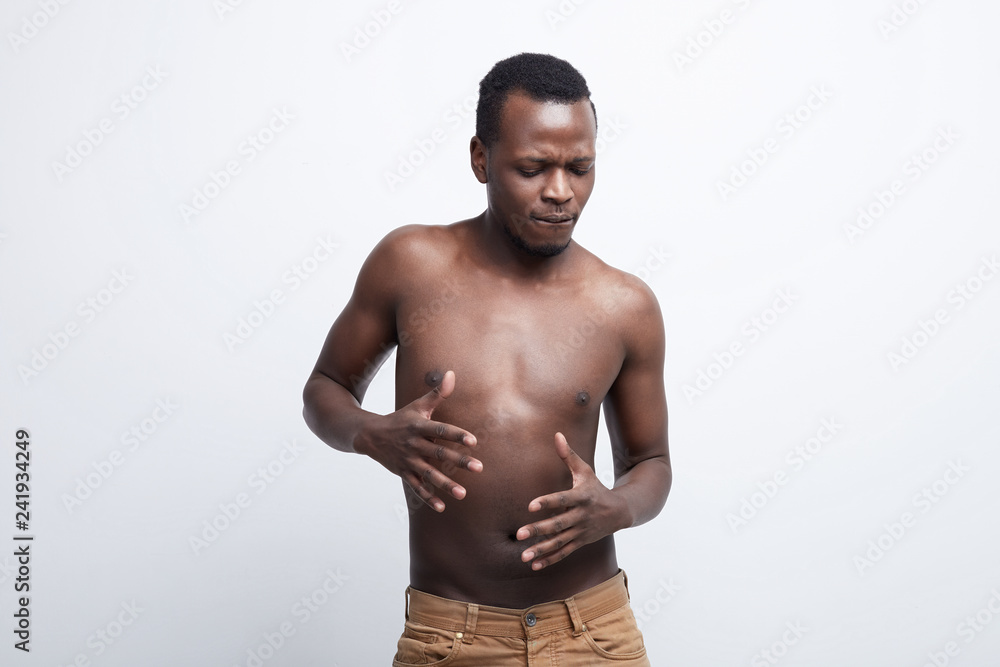 Intimate portrait of African American male moving with passionate expression, dancing to deepest sounds, feeling connection with music, expressing true feeling and emotions. Human nature concept. Intimate portrait of African American male moving with passionate expression, dancing to deepest sounds, feeling connection with music, expressing true feeling and emotions. Human nature concept.