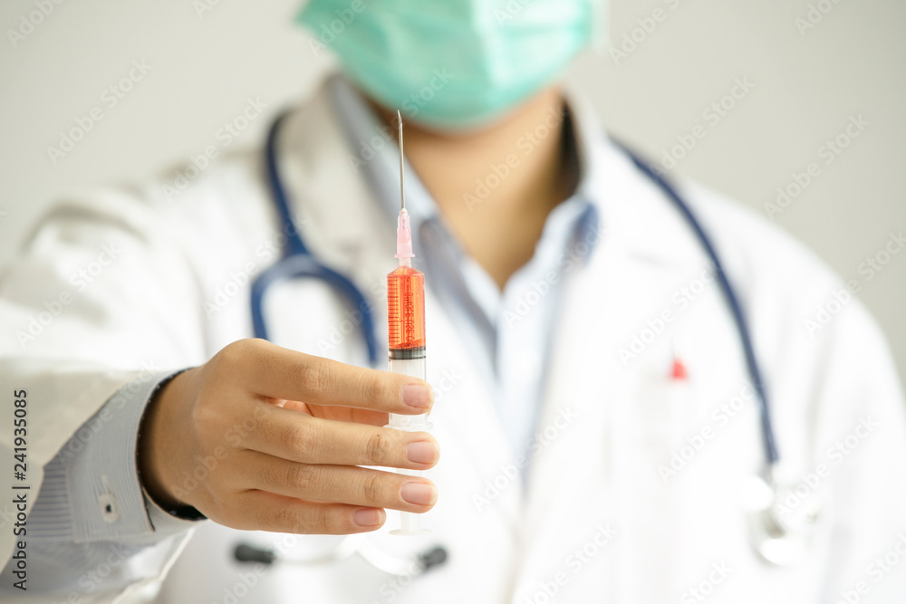 female doctor with mask hold syringe isolated on white background female doctor with mask hold syringe isolated on white background