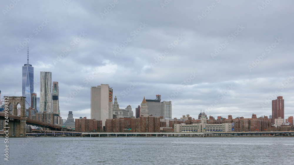 Manhattan skyline viewed from Brooklyn with Brooklyn bridge, in New York City, USA Manhattan skyline viewed from Brooklyn with Brooklyn bridge, in New York City, USA