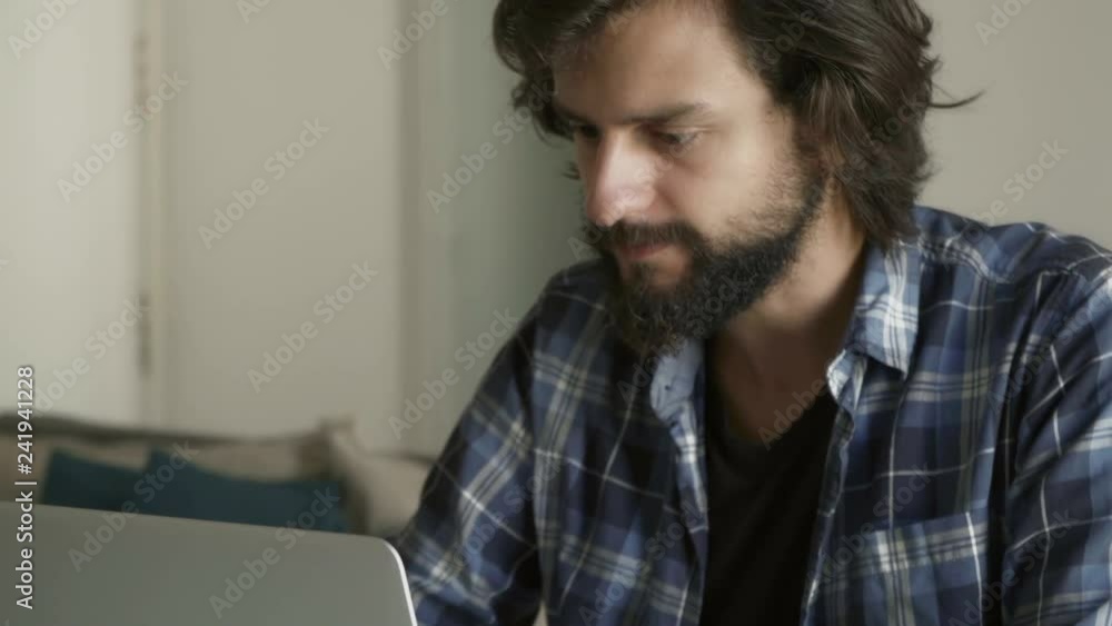 Thoughtful businessman working with laptop at home. Thoughtful businessman working with laptop at home.