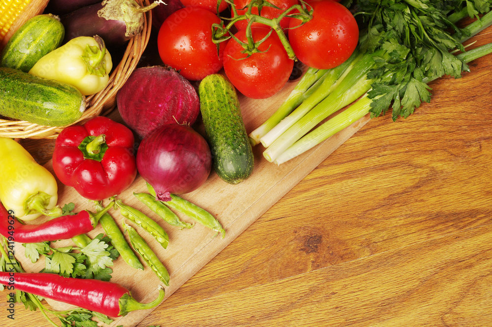 A variety of delicious vegetables on the kitchen board. Copy space. A variety of delicious vegetables on the kitchen board. Copy space.