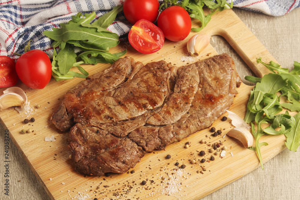 A beef steak well done with vegetables A beef steak well done with vegetables