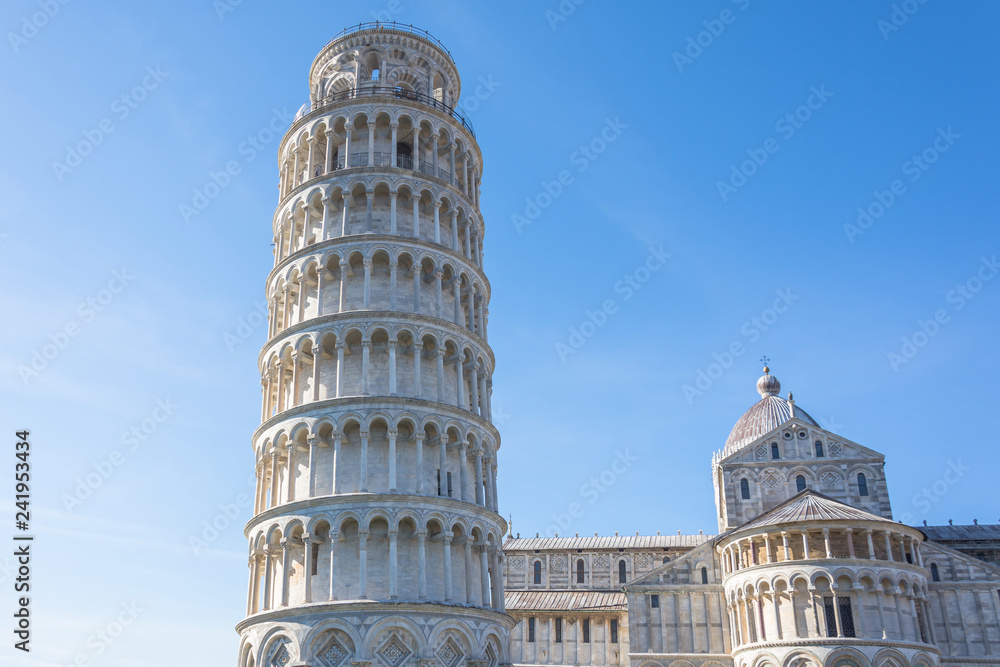 Pisa cathedral and the leaning tower in a sunny day in Pisa, Italy.