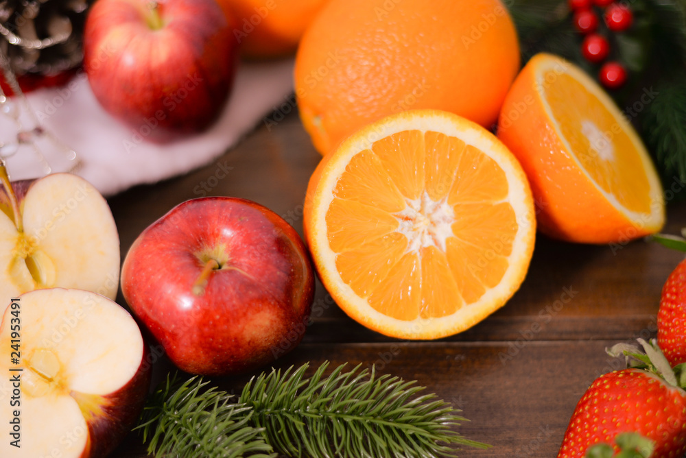 Citrus fruits on wooden background on rustic background ,oranges, strawberries , mandarins, clementines , apples . Healthy eating and dieting concept. Winter assortment Citrus fruits on wooden background on rustic background ,oranges, strawberries , mandarins, clementines , apples . Healthy eating and dieting concept. Winter assortment